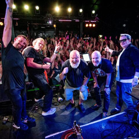 Band with the crowd behind them at Club 85