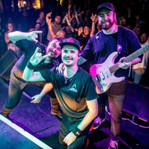 Band celebrating on stage